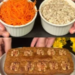 Muffins de zanahoria y nuez recién horneados en una bandeja