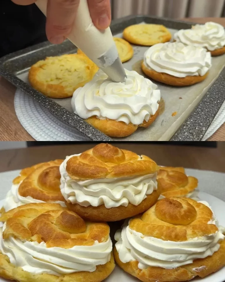 Profiteroles de crema de limón con adornos de azúcar y limón fresco.