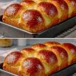 Brioche francés recién horneado, suave y dorado en una mesa