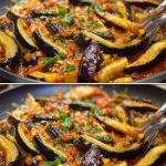 Plato de espagueti de berenjena con salsa fresca y albahaca.