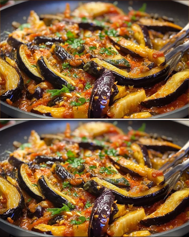 Plato de espagueti de berenjena con salsa fresca y albahaca.