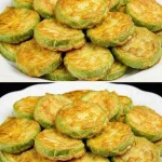 Plato de gratinado de calabacín, servido con queso gratinado y hierbas frescas.