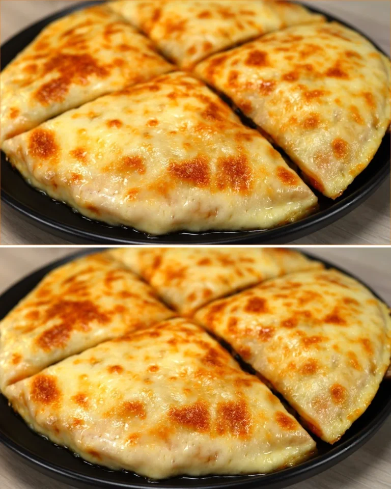 Tortilla rellena con ingredientes frescos y coloridos sobre un plato.